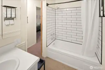 New tiled shower surround in the bathtub and shower.