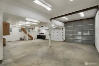 Huge shop area w/ pellet stove & loft area.  10x12 RV door and a 10x7 garage door.