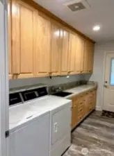 Spacious laundry room with lots of storage and more solid maple cabinets. #1250 Northcliff Rd, Shelton, WA 98584