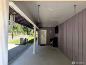 Rear patio area, with covered section with flat screen TV that stays. Ideal for entertaining. #1250 Northcliff Rd, Shelton, WA 98584