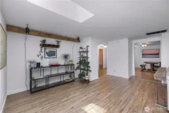 Extra large living room has extra space for an office set up, reading nook, or plant wall.