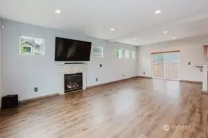 Large living room TV and sound system stay.