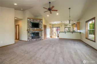 Rock fireplace is focal point of living room