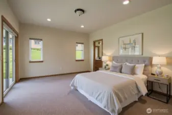 Primary bedroom (virtually staged) with slider to patio