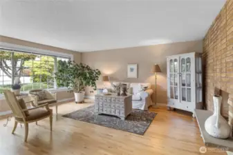 Sparkling Original hardwoods welcome you in to the front living room