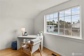 Overlooking the backyard and pool.