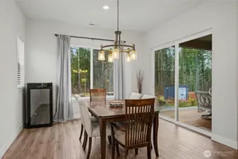 This dining space is made for lingering. Natural light, peaceful views, and easy access to the patio make it just as perfect for weeknight dinners as it is for weekend gatherings.