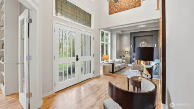 Step through the dramatic two-story foyer and you’re greeted by gleaming hardwoods and a custom wrought-iron staircase that gracefully introduces the formal living and dining rooms.