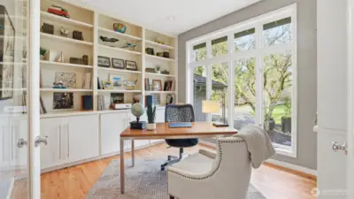 Just off the entry foyer, this light-filled, handsome den, is ideal for work or quiet moments.  Custom built-ins provide the extra touch and perfect place to store supplies.