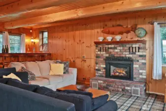 A wood-burning fireplace creates the perfect gathering space.