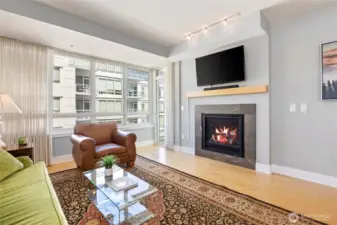 The glass door to left of fireplace leads to a water facing deck.