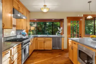 The kitchen is a cooks delight with top end appliances and solid surface counters.