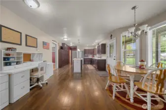 Large kitchen with eating, center island and desk/office area.