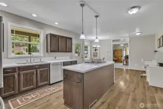 Large kitchen with eating, center island and desk/office area.
