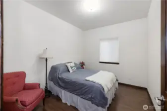 Downstairs bedroom / bonus room. Across from bath room. All ADA sized doorways throughout the home.