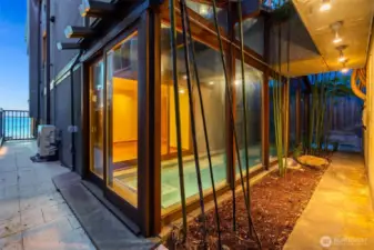 Surrounded by glass and concrete walls, the lap pool provides a private, light-filled space perfect for relaxation and year-round use.