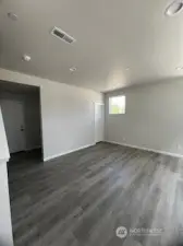 Media room main floor with 3/4 bathroom and storage example only
