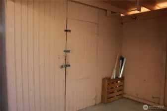 Large storage shed under carport.