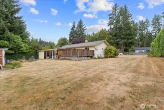 This generous 9,720 square foot lot is fully fenced, with RV parking and a large, expandable gate.