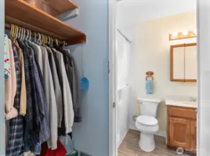 Main bedroom's walk-in closet and direct access to the bathroom.