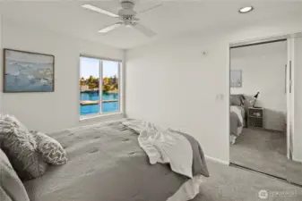 Second/guest bedroom features a view to the Kirkland Marina and lake.