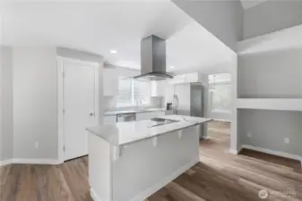 ~Gorgeous new kitchen with white cabinetry, quartzite countertops, stainless-steel appliances, a large island, and a pantry~