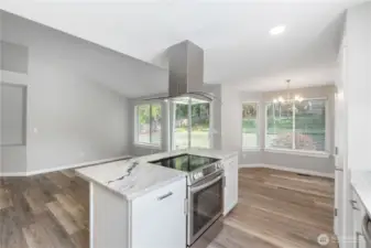 ~Gorgeous new kitchen with white cabinetry, quartzite countertops, stainless-steel appliances, a large island, and a pantry~