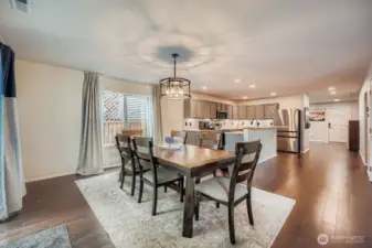 Dining area looking back at open concept kitchen