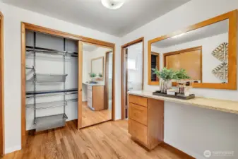 Custom closet shelving in the primary bedroom to maximize storage