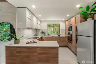 The kitchen has been thoughtfully opened up and updated, creating a more inviting space.