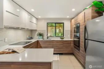 The new kitchen is a dream come true for any aspiring chef, with plenty of extra storage and room to work on their culinary creations!