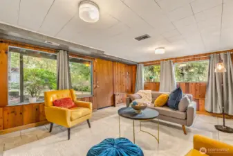 Downstairs spacious rec room with foireplace and lots of bug sunny windows