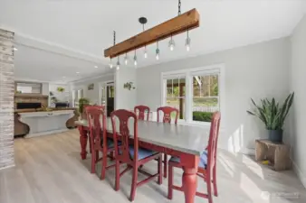 Expansive dining room great for entertaining guests. The light fixture pictured will not stay in the home.