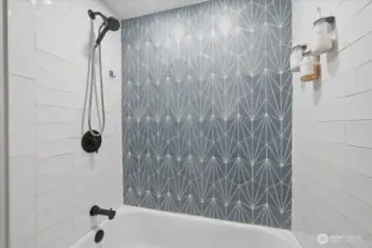 The shower surround on main floor has been mindfully updated in recent years.