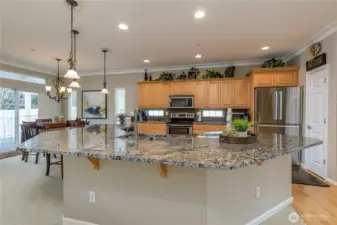 Chef’s dream! The remodeled kitchen boasts a massive granite slab island, perfect for meal prep and casual dining