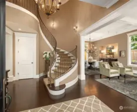 10’-12’ ceilings throughout the light-filled main floor with open winding staircase entry,