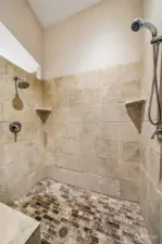 Main home. Primary bedroom with ensuite bathroom