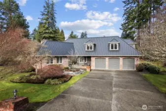 Great curb appeal with a large driveway for guests.