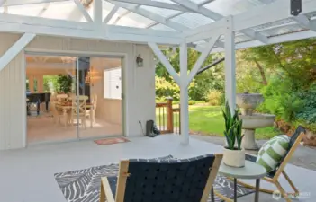 WOW, talk about outdoor living! This massive covered deck was just installed last year, offering incredible space. And look at that fantastic flat, grassy area – perfect for playtime with little ones or furry friends!