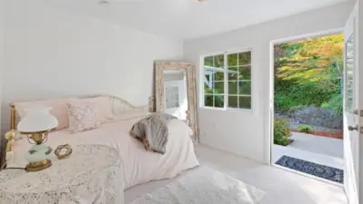 Airbnb potential? This upstairs bedroom with its own private entrance from the gorgeous back yard offers great flexibility for guests to come and go independently.