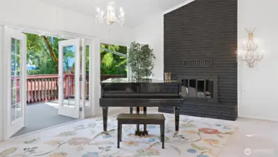 Thoughtful updates meet timeless elegance! These recently installed French doors and picture windows perfectly complement the home's character, including the stunning crystal chandeliers – the chandelier above the piano was $6,000 when new in 2006, and the chandelier next to the fireplace was $5000 when new in 2006.