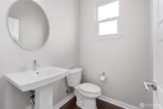 Powder room/half bath just inside entrance on the way to the kitchen!
