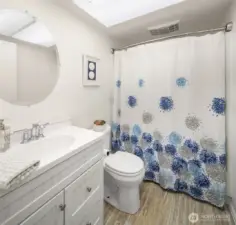 Well-placed full bathroom just steps from bedrooms for added convenience