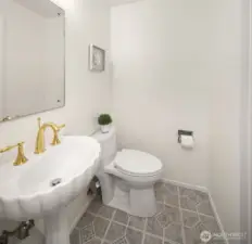Conveniently located half bath between the primary and fourth bedroom, offering privacy and easy accessibility