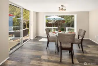 Oversized windows bathe the room in sunlight
