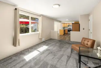 Flexible space adjacent to the kitchen, perfect for additional lounge area