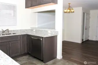 Convenient pass through window to dining room space. Could be utilized as bar seating on the other side potentially as well.