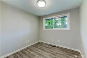 third Bedroom. Perfectly suited for use as a guest room, nursery, or productive home office.