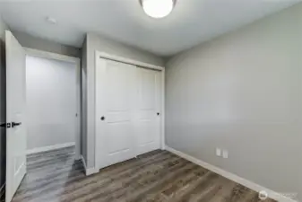 Cozy and efficient third bedroom with sliding-door closet