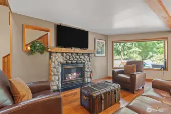 Large living room with stone fireplace